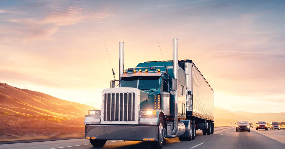 Blue semi truck on highway