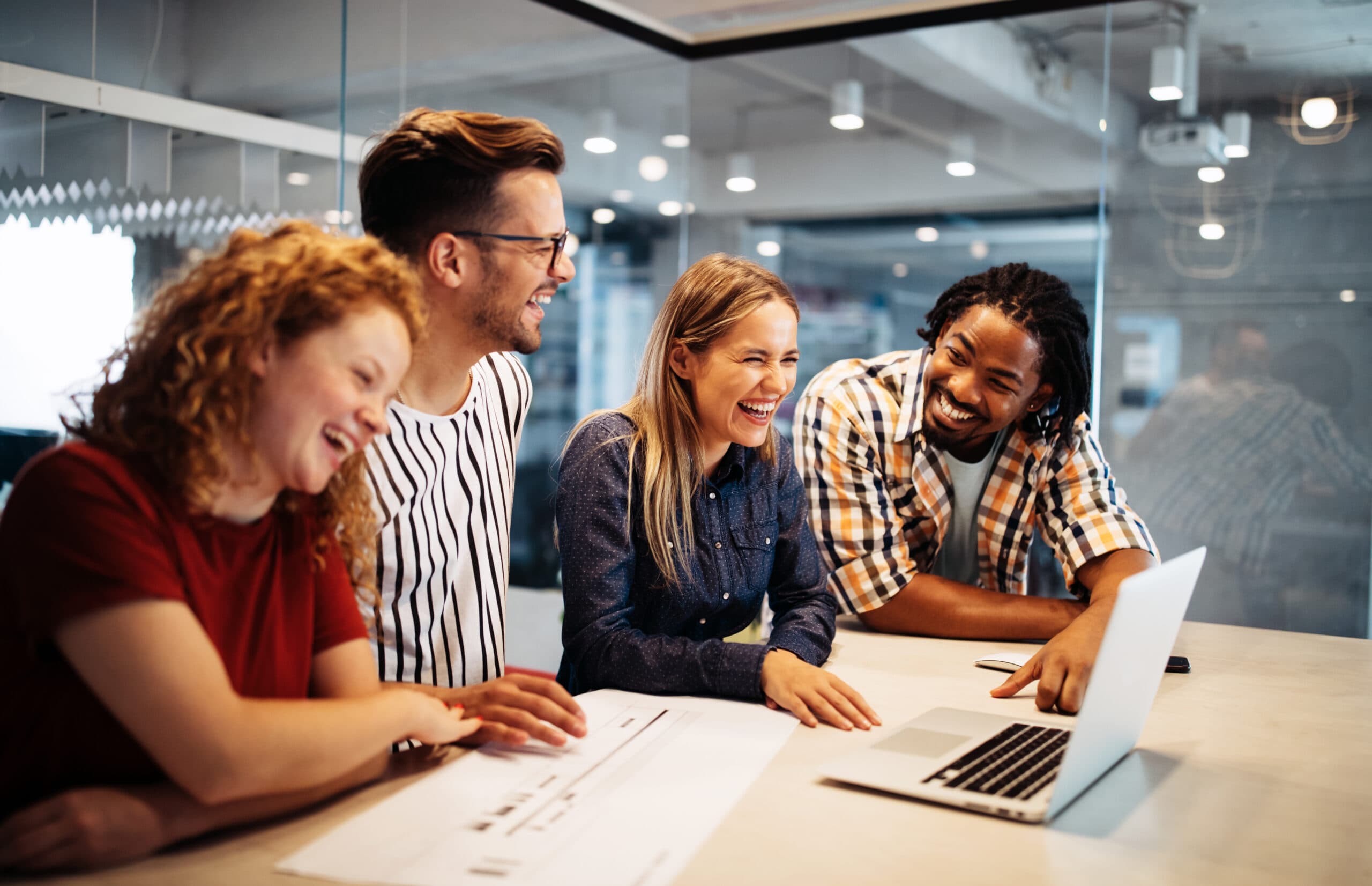 Happy creative designers, business people brainstorming and working at workplace