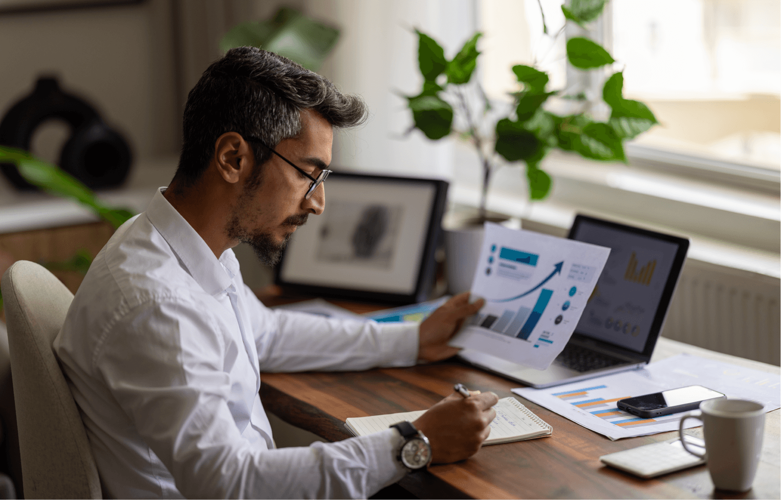 Man reviewing paperwork on information