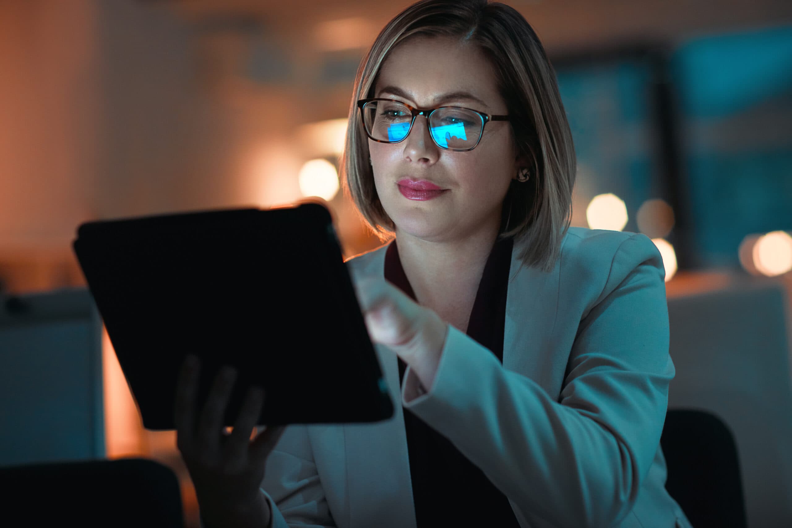 Business woman, tablet and typing in office for corporate communication, internet research and networking. Female person, technology and working late night for project planning and email conversation.