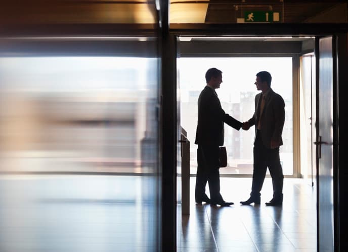 2 men shaking hands